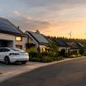 Renewable energy is used in daily life through solar homes, electric vehicles, wind power, and solar street lights